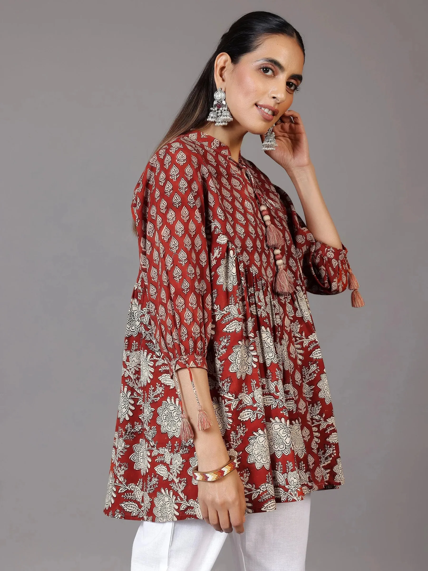 2_f2488401-5108-4ea6-b8e6-08d981aae839.webp Rust Printed Cotton A-Line Kurti - Image 1